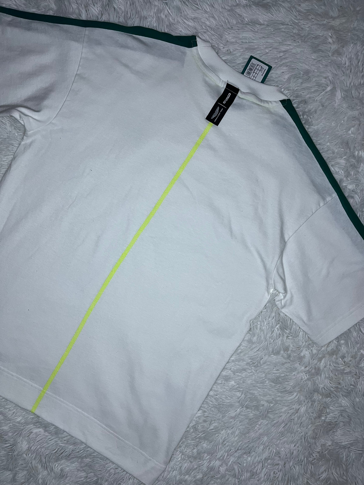 POLERA PUMA ASTON MARTIN F1 2026 BLANCA DE CORTE HOLGADO