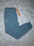 PANTALÓN DE BUZO CELESTE MCLAREN RACING 2026