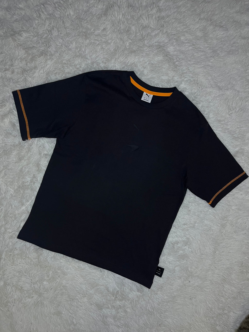 POLERA PUMA MCLAREN RACING 2026 NEGRA DE CORTE HOLGADO