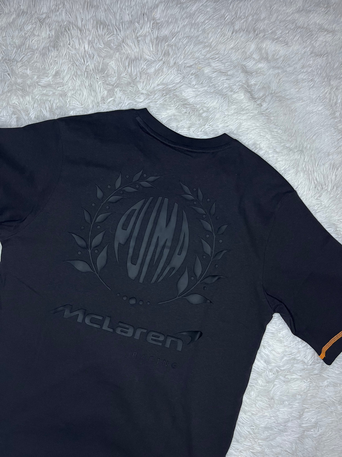 POLERA PUMA MCLAREN RACING 2026 NEGRA DE CORTE HOLGADO