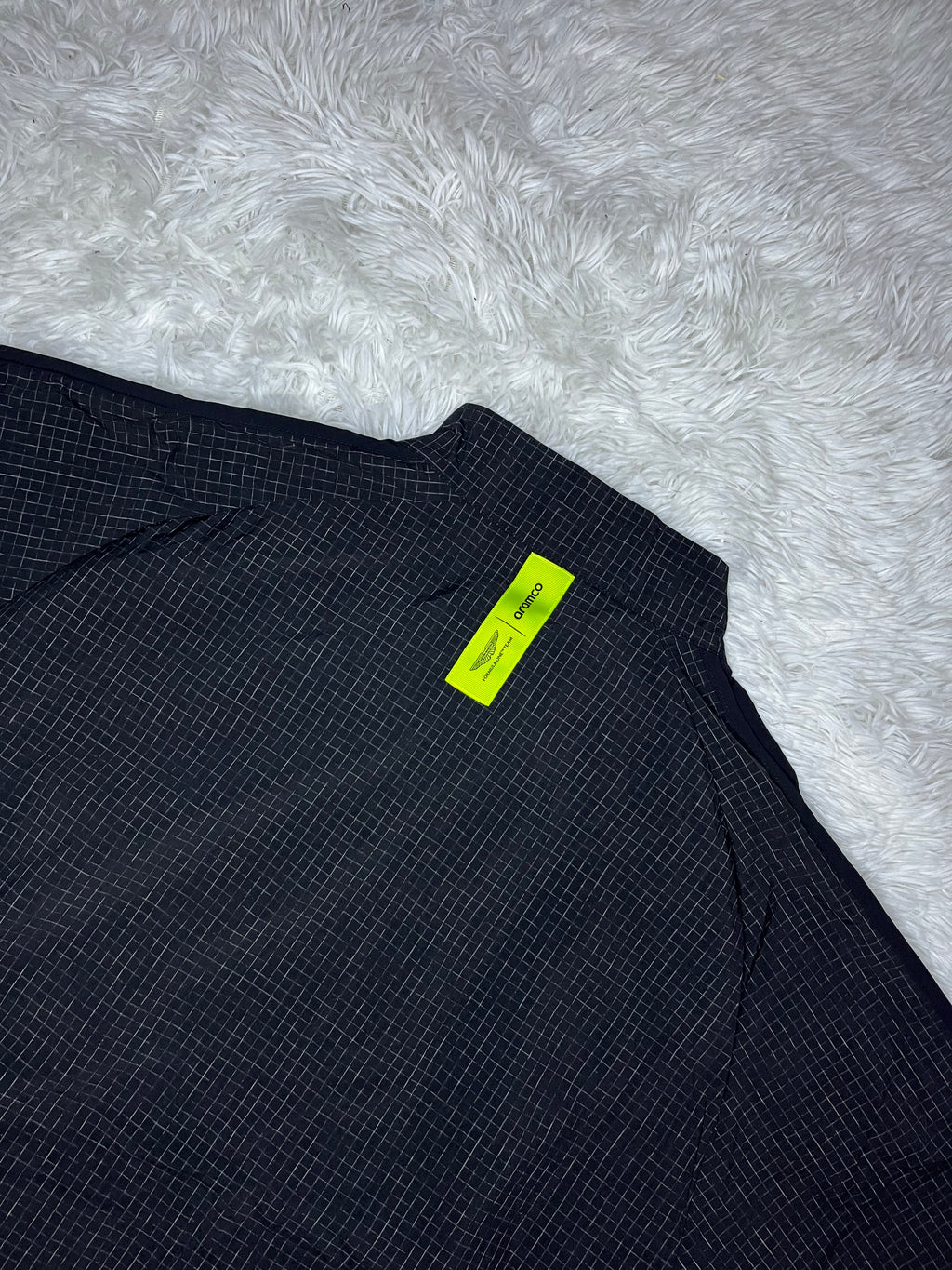CHAQUETA CORTAVIENTO NEGRA PUMA ASTON MARTIN F1 2026