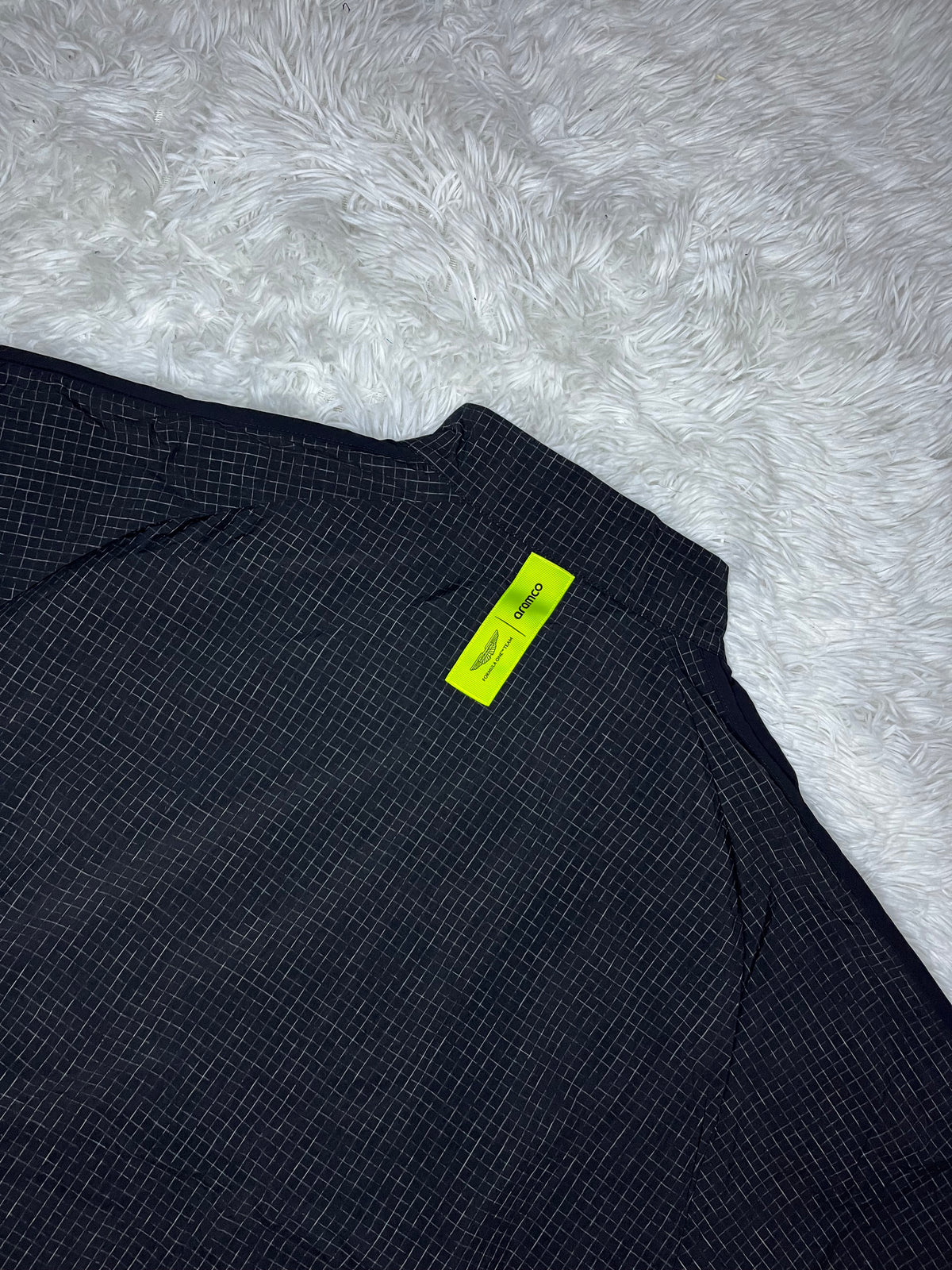 CHAQUETA CORTAVIENTO NEGRA PUMA ASTON MARTIN F1 2026