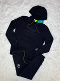 CONJUNTO PUMA ASTON MARTIN 2026 NEGRO: POLERÓN Y PANTALÓN