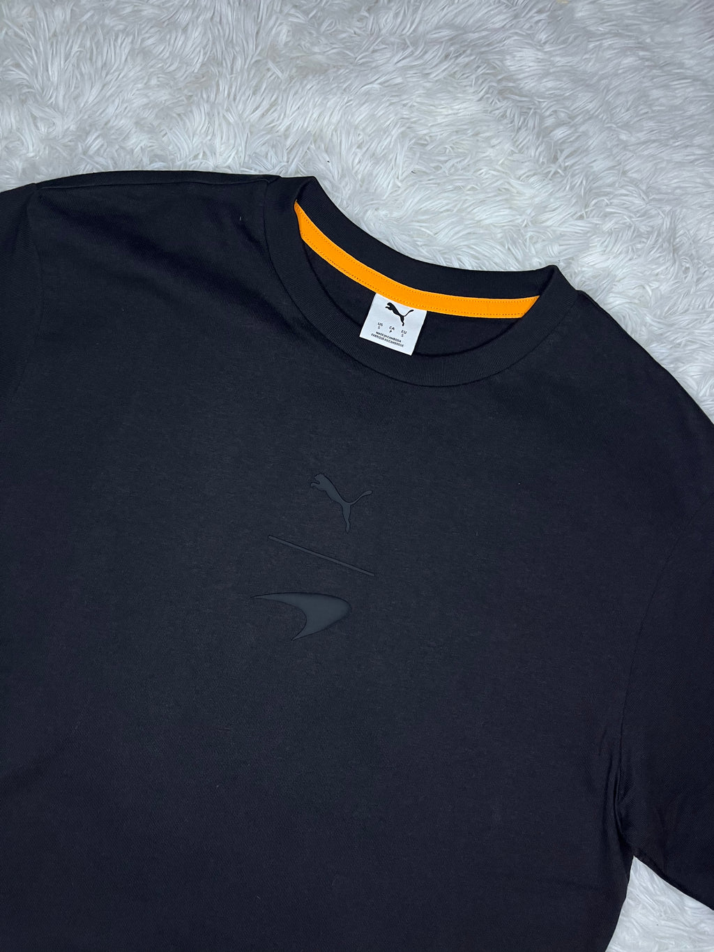 POLERA PUMA MCLAREN RACING 2026 NEGRA DE CORTE HOLGADO